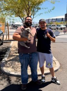 Arizona breeder partnership with a blue French Bulldog, photographed outdoors near a venue.
